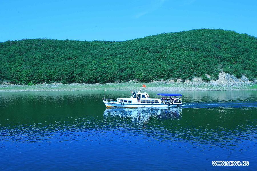 Photo taken on July 7, 2012 shows the scenery of the Jingbo Lake in Ning'an, northeast China's Heilongjiang Province. (Xinhua/Zhang Yanhui) 