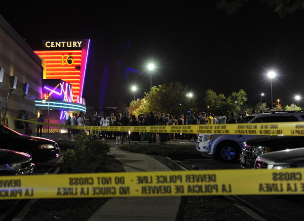 Police cordon off an scene at a movie theater where a shooting killed 14 people wounded 50 others during a showing of new Batman film 'The Dark Knight Rises' in Denver in the early hours of Friday. [Photo/Xinhua] 