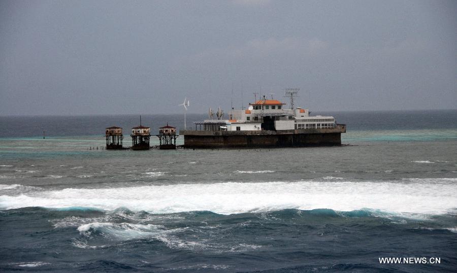 Photo taken on July 20, 2012 shows a building on Meiji Reef of south China Sea. The fleet of 30 boats, including a 3,000-tonne lead boat carrying fresh water, fuel and other supplies, sailed into the lagoon of Meiji Reef to take shelter from storm at about 6 p.m. Friday. The fleet has sailed past Sanya and Yongshu, Zhubi and Meiji reefs. [Xinhua]