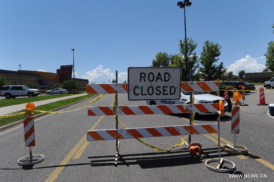 Road leading to the Century 16 Movie Theaters, where the shooting rampage happened, is sealed off in Aurora, Colorado, July 22, 2012. Twelve people were killed and 59 others injured at a Batman movie premier, where a lone, heavily armed gunman burst into a packed theater in a suburb 10 miles east of Denver during the wee hours of Friday. (Xinhua/Yang Lei) 