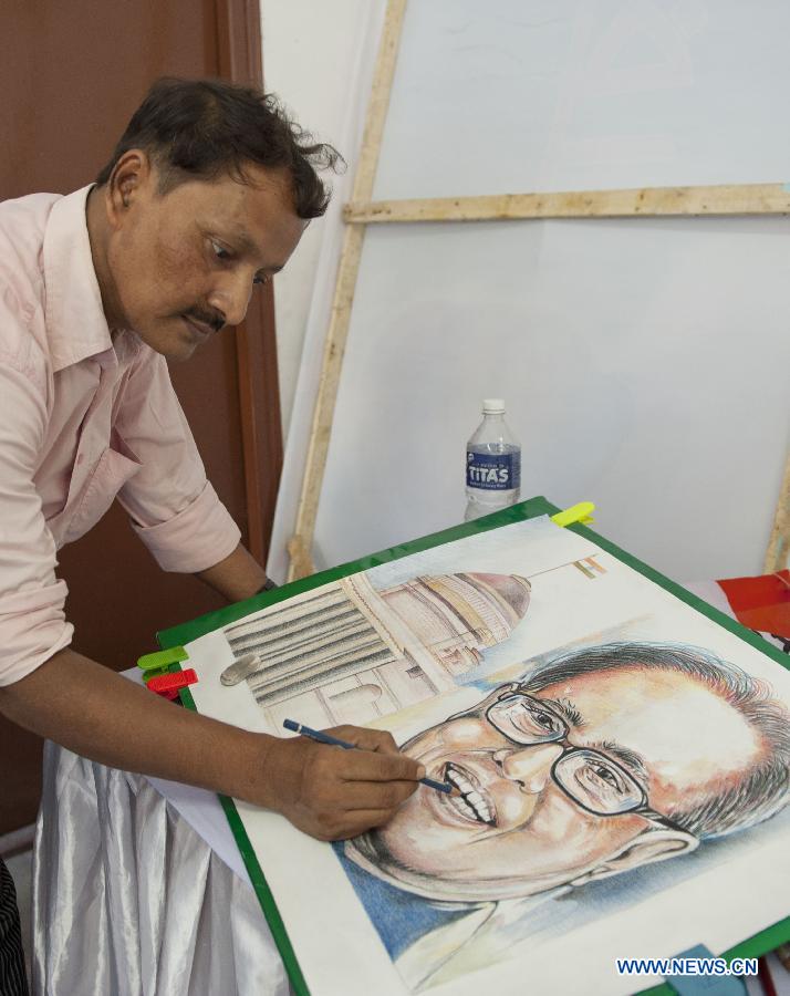 A supporter of Indian National Congress paints Pranab Mukherjee's portrait as he celebrates for the newly elected president and former finance minister Pranab Mukherjee in Calcutta, on 22 July 2012. India's Congress heavyweight and former finance minister Pranab Mukherjee has been elected the 13th president of India, according to the outcome of official accounts of votes Sunday. (Xinhua/Tumpa Mondal) 