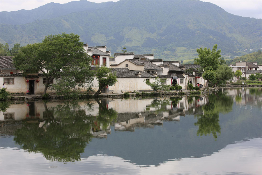 Hongcun Village is located in Yixian County at the foot of the southwestern slope of Huangshan Mountain, Anhui Province. With morning mist, stone bridges, white walls, water lily ponds and hills, it has been described as a village out of a traditional Chinese ink painting. Besides halls, pavilions and temples, the village consists of 160 ancient residences. 