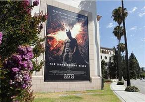 A poster for the Warner Bros. film 'The Dark Knight Rises' is displayed at Warner Bros. studios in Burbank, California, July 20, 2012.