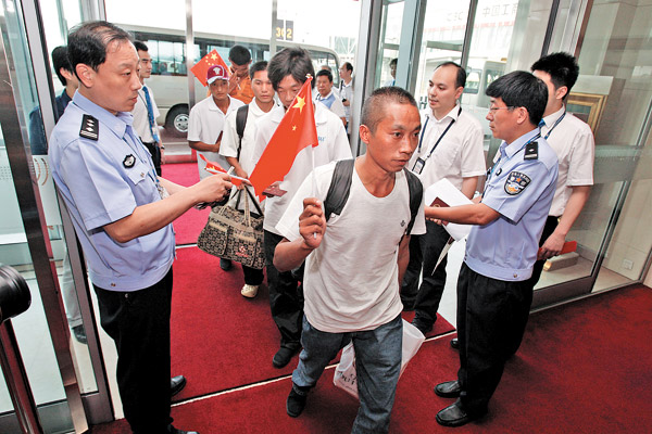 Crew members of Taiwan trawler Xu Fu 1 arrive in Beijing on Tuesday after their release by Somali pirates on July 17. [ Photo / China Daily ]