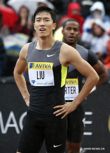 China&apos;s Liu Xiang views the score board after competing during the heats of men&apos;s 110m hurdle during the star-studded Aviva London Grand Prix at the Crystal Palace in London, the United Kingdom, July 13, 2012.