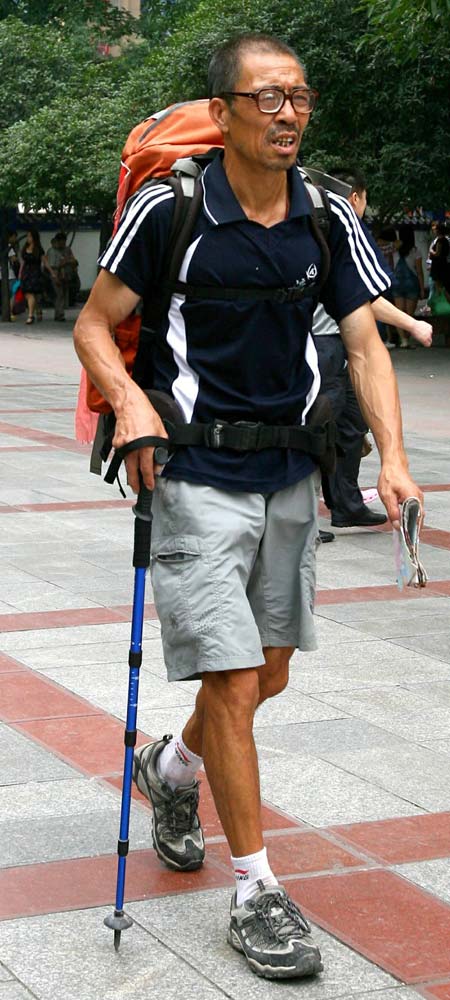 Jin Shiming, 60, who has hiked more than 80,000 km across the country over the past seven years, explores Chongqing municipality in June.