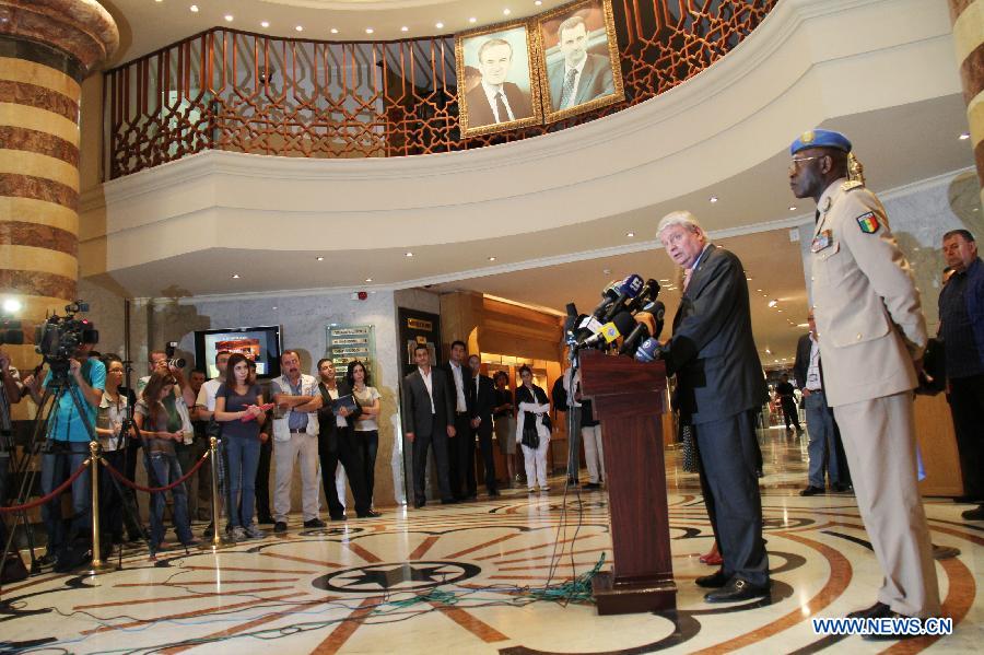 UN Under-Secretary-General for Peacekeeping Operations Herve Ladsous (2nd R) and Lieutenant General Babacar Gaye (1st R), the new head of the UN Supervision Mission in Syria, attend a press conference in Damascus, Syria on July 26, 2012.(Xinhua/Hazim) 