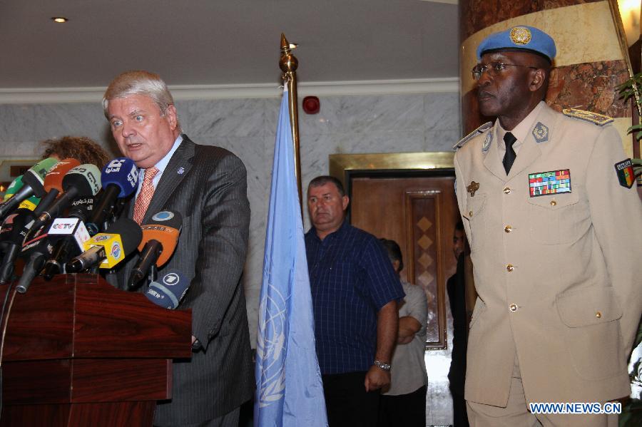 UN Under-Secretary-General for Peacekeeping Operations Herve Ladsous (2nd R) and Lieutenant General Babacar Gaye (1st R), the new head of the UN Supervision Mission in Syria, attend a press conference in Damascus, Syria on July 26, 2012.(Xinhua/Hazim) 