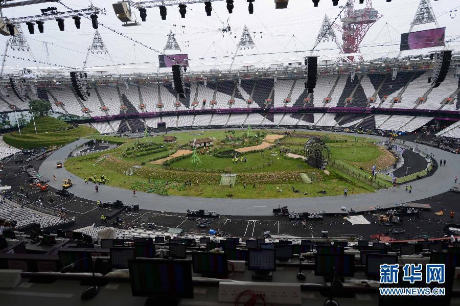 London Games staff members are setting up the scenes in the London Olympic Stadium for the opening ceremony of the 30th Summer Olympic Games. [Xinhua]