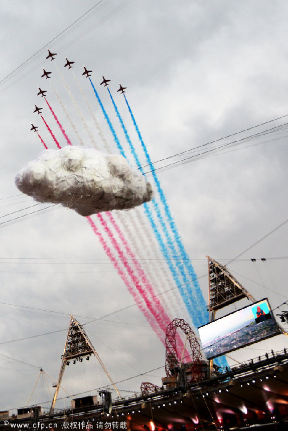 The Red Arrows, the Royal Air Force aerobatic team fly over the olympic park during the Opening Ceremony of the London 2012 Olympic Games at the Olympic Stadium on July 27, 2012 in London, England. [CFP]