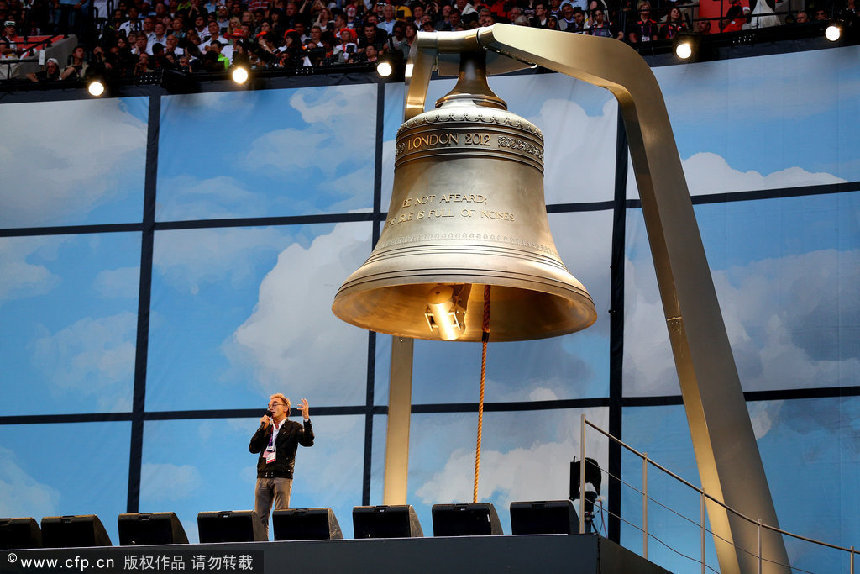 Artistic Director of the Opening Ceremony Danny Boyle speaks whilst standing next to the Olympic Bell during the Opening Ceremony of the London 2012 Olympic Games at the Olympic Stadium on July 27, 2012 in London, England. [CFP]