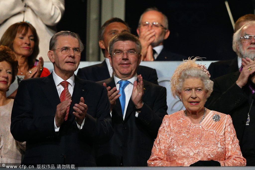 Queen Elizabeth II (R) and Jacques Rogge (L), President of the International Olympic Committee, attend the Opening Ceremony of the London 2012 Olympic Games at the Olympic Stadium on July 27, 2012 in London, England. [CFP]