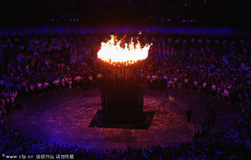 The Olympic Cauldron is lit during the Opening Ceremony of the London 2012 Olympic Games at the Olympic Stadium on July 27, 2012 in London, England. [CFP]