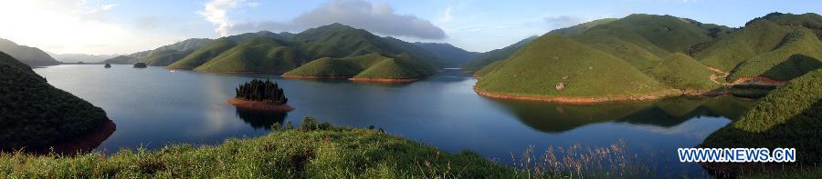 Photo taken on July 29, 2012 shows the scenery of Tianhu Scenic Spot of Quanzhou County, south China's Guangxi Zhuang Autonomous Region. The Tianhu Scenic Spot, with the height of over 1,600 meters above sea level, is a lake district containing 13 reservoirs and high mountain forests. (Xinhua/Liang Qian)