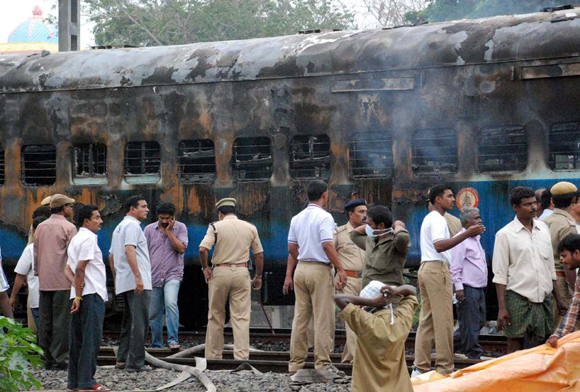 At least 30 people were confirmed dead while more than 25 others sustained burns in a major fire that engulfed one of the coaches of an express train in the southern Indian state of Andhra Pradesh early Monday. 