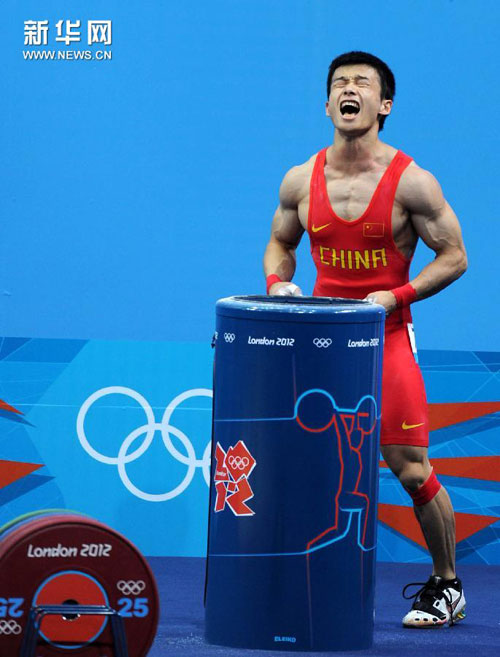 Wu Jingbiao wins silver in the men's 56kg weightlifting event at the London Olympic Games, July 29, 2012.