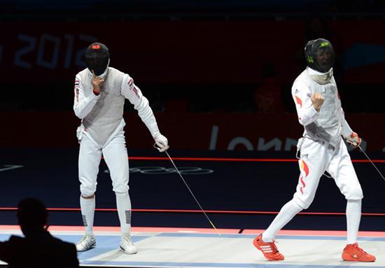 Lei Sheng of China (R) competes with Alaaeldin Abouelkassem of Egypt during men's fencing Foil individual gold medal match, at London 2012 Olympic Games in London, Britain, on July 31, 2012. Lei Sheng of China won. [Xinhua]