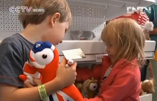 Children pick souvenir at London's biggest Olympic souvenir megastore.