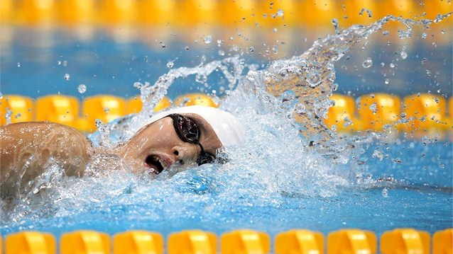 Ye Shiwen of China speeds through heat 5 of the women's 200m Individual Medley on Day 3.  