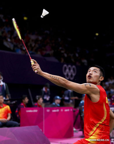 Lin Dan of China competes during men's badminton singles round of 16 contest, at London 2012 Olympic Games in London, Britain, on August 1, 2012. Lin Dan of China defeated Taufik Hidayat of Indonesia 2-0. [Xinhua]