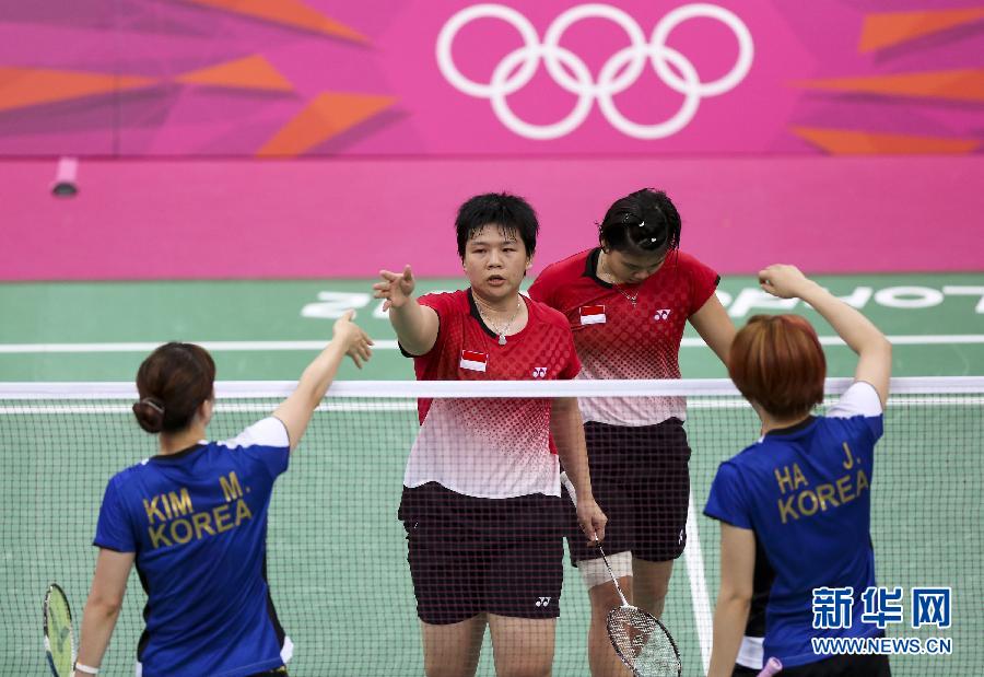 The Badminton World Federation has disqualified eight players after accusing them of 'not using one's best efforts to win'. Four pairs of players - two from South Korea and one each from China and Indonesia - are out of the Olympics after their matches on Tuesday. In the picture are South Korean players Ha Jung-eun and Kim Min-jung and Indonesia's Meiliana Jauhari and Greysia Polii.