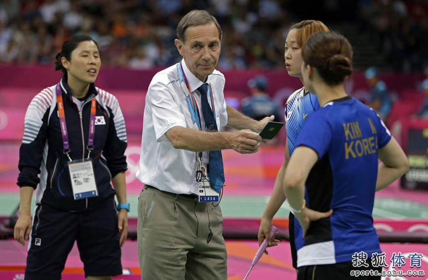 The Badminton World Federation has disqualified eight players after accusing them of 'not using one's best efforts to win'. Four pairs of players - two from South Korea and one each from China and Indonesia - are out of the Olympics after their matches on Tuesday. In the picture, the referee shows a black card warning the athletes during the match.