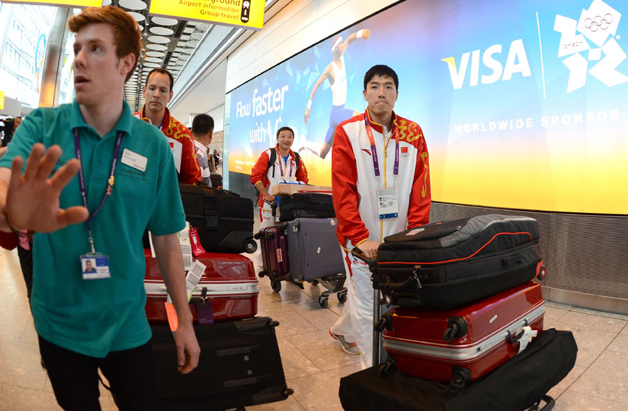 China's 110m hurdler Liu Xiang arrives at Heathrow airport in London, Britain, on August 3, 2012. Liu Xiang will compete in men's 110m hurdles competition of athletics at the London 2012 Olympic Games. [Xinhua]