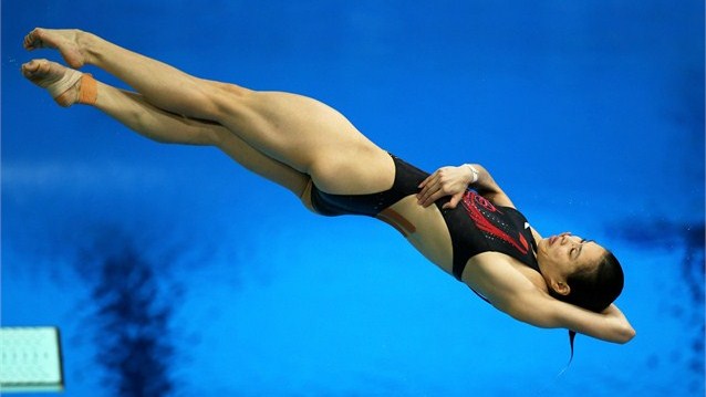 Wu Minxia of China competes in the women's 3m springboard diving preliminary round on Day 7 of the London 2012 Olympic Games at the Aquatics Centre.