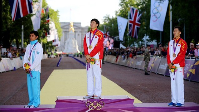 Gold medallist Chen Ding of China poses