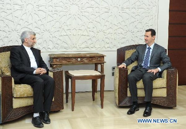 Syrian President Bashar al-Assad(R) meets with visiting Saeed Jalili, secretary of Iran's Supreme National Security Council, in Damascus, capital of Syria, Aug.7, 2012. [Xinhua/SANA] 