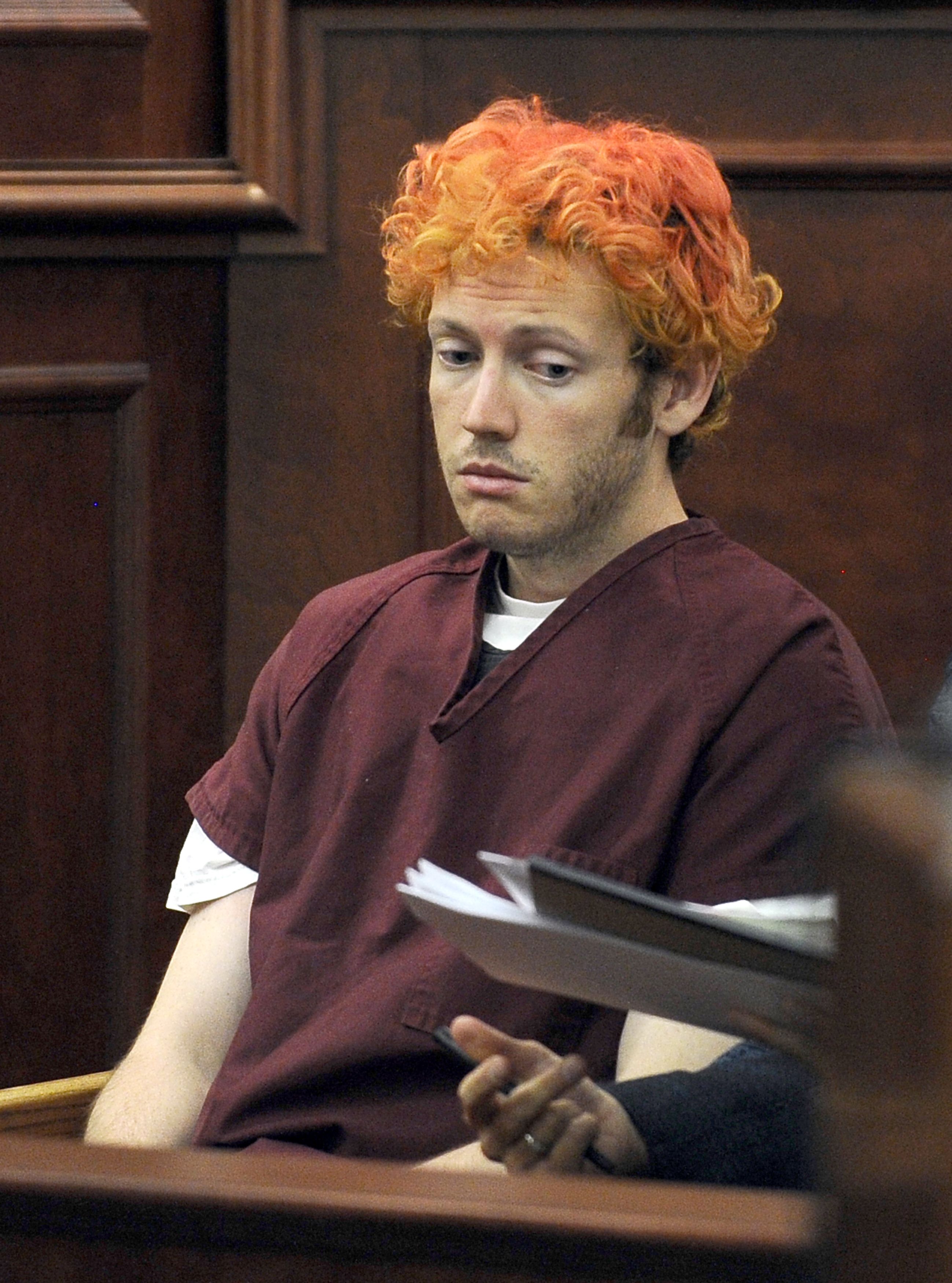 James Holmes appears in court at the Arapahoe County Justice Center July 23, 2012 in Centennial, Colorado. Holmes, 24, is accused of shooting dead 12 people and wounding 58 others at a cinema Friday in Aurora, outside Denver, as young moviegoers packed the midnight screening of the latest Batman film, 'The Dark Knight Rises.' [Xinhua] 