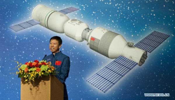 Shenzhou-9 astronaut Liu Wang delivers a speech during a dialog with local students in Hong Kong, south China, Aug. 11, 2012. A dialog between astronauts, Jing Haipeng, Liu Wang and Liu Yang who partook in China's Tiangong-1/Shenzhou-9 space docking mission, and Hong Kong students was held Saturday at the Hong Kong Convention and Exhibition Center. [Xinhua]