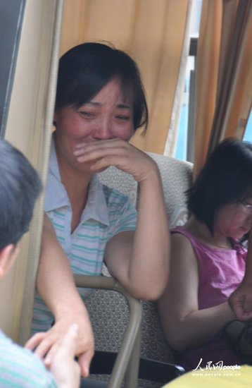 The petitioning mother of a rape victim began her journey home on Saturday after being released from a labor camp in central China's Hunan province.
