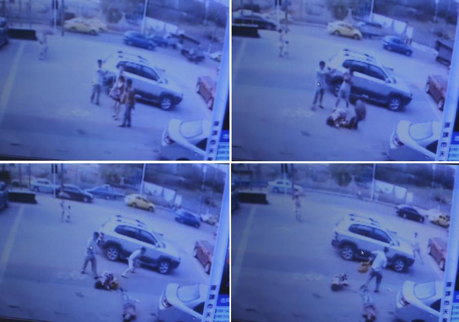 Screen shots taken from a surveilance camera video on Aug. 10, 2012 show an armed robbery in front of a bank in southwest China's Chongqing Municipality. One person was shot dead and two others were injured in an armed robbery in Chongqing Municipality Friday morning. Police have launched a manhunt for the serial killer believed to be behind the robbery.