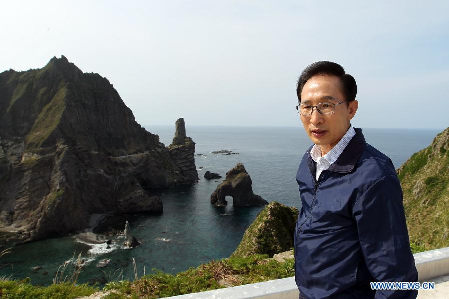 South Korean President Lee Myung-bak visits a set of disputed islets called Dokdo in Korean and Takeshima in Japanese, east of Seoul, Aug. 10, 2012. The president paid a landmark visit Friday to a set of disputed islets claimed by both South Korea and Japan after a stop on the nearby Ulleung Island, an unprecedented trip that raised Tokyo's ire. 