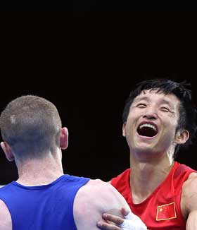 Zou Shiming experienced a breathtaking semifinal against Paddy Barnes from Ireland to advance into the final on men's 49kg category at London Olympics in London on Friday. [Wang Shen/Xinhua]