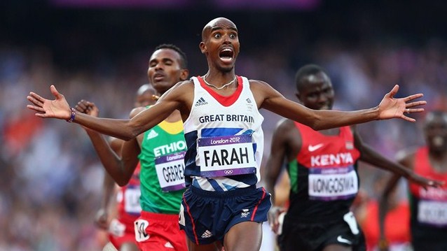 Mo Farah crosses the finish line to win gold in the men's 5000m final on Day 15 at London 2012.  