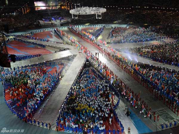 Delegation flags, athletes enter the stadium at the closing ceremony.