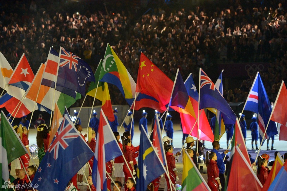 Delegation flags enter the stadium at the closing ceremony. 