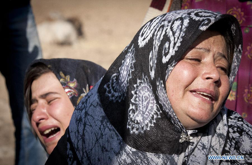 Two Iranian women cry after an earthquake in Varzaqan in northwest Iran, on Aug. 12, 2012. The death toll of Saturday&apos;s strong twin quakes in northwest Iran has risen to some 300, the semi- official Fars news agency cited an official as saying on Sunday. 