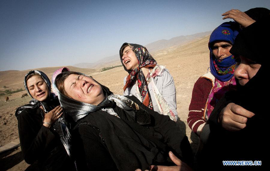 Iranian women cry after an earthquake in Varzaqan in northwest Iran, on Aug. 12, 2012. The death toll of Saturday&apos;s strong twin quakes in northwest Iran has risen to some 300, the semi- official Fars news agency cited an official as saying on Sunday. 