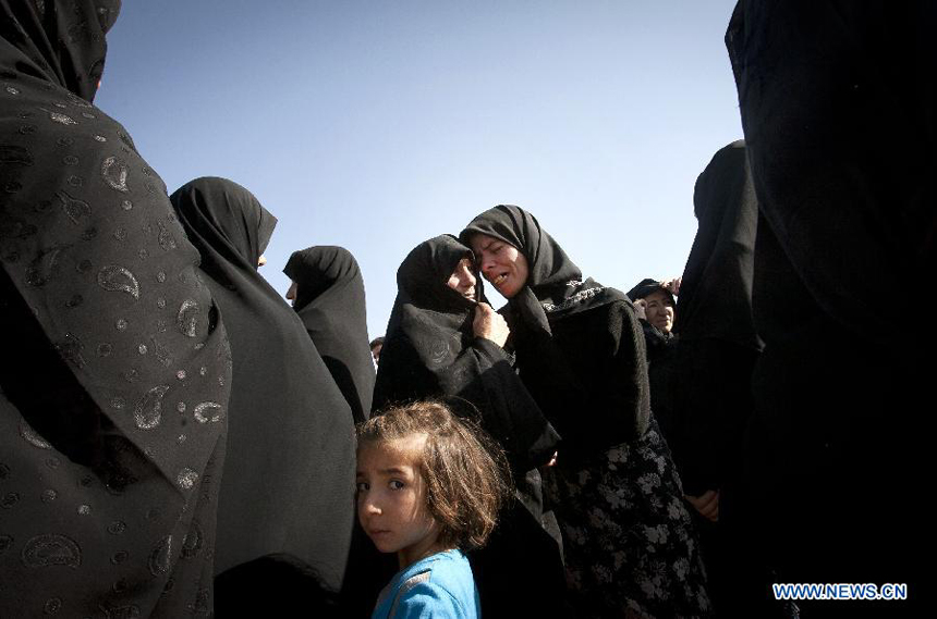 Iranian women mourn after an earthquake in Varzaqan in northwest Iran, on Aug. 12, 2012. The death toll of Saturday&apos;s strong twin quakes in northwest Iran has risen to some 300, the semi-official Fars news agency cited an official as saying on Sunday. 