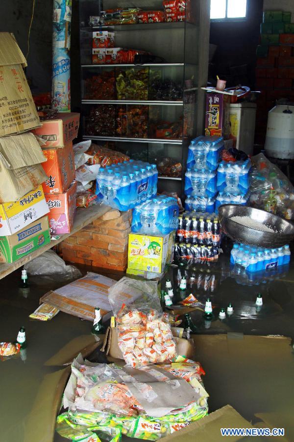 Photo taken on Aug. 12, 2012 shows the interior of a flooded supermarket after the wallop of Tyhpoon Haikui in Yexing Village of Hougang Town in Leping City, east China&apos;s Jiangxi Province. The typhoon have had an impact on 1.13 million people in the province and China&apos;s central authorities initiated a level-four emergency plan on Saturday in response to torrential rains and flooding caused by typhoon Haikui in Jiangxi province. 