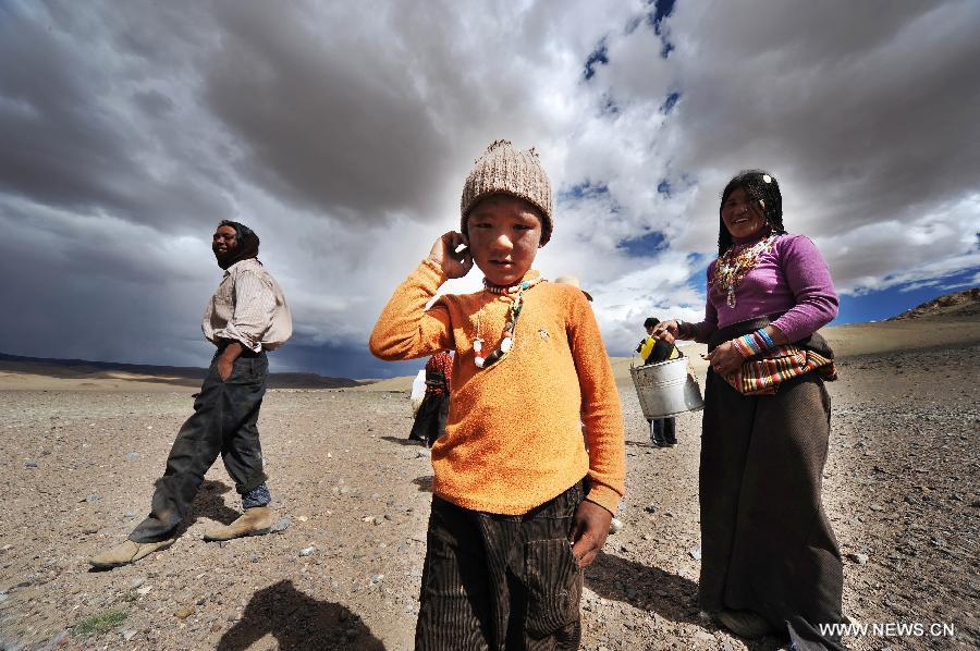 #Nomad Basang's son Dorji (front) plays in the Gerze County of Ali, southwest China's Tibet Autonomous Region, Aug. 11, 2012