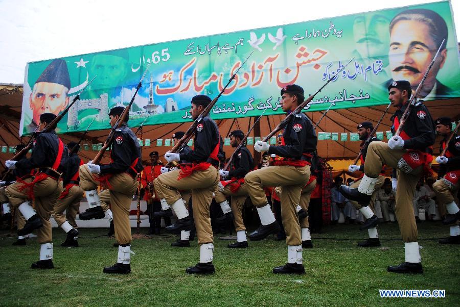 Pakistani policemen attend a ceremony to celebrate 65th Pakistan's Independence Day in northwest Pakistan's Peshawar on Aug. 14, 2012. 