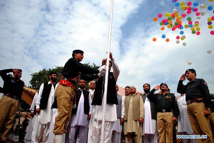 Pakistani government officials attend a ceremony to celebrate 65th Pakistan's Independence Day in northwest Pakistan's Peshawar on Aug. 14, 2012. 