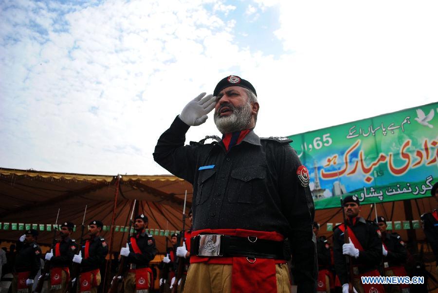 Pakistani policemen attend a ceremony to celebrate 65th Pakistan's Independence Day in northwest Pakistan's Peshawar on Aug. 14, 2012.