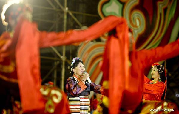 Singer Tseten Dolma performs during the opening ceremony of 2012 Tibet Yarlung Cultrual Festival in Zetang county of Shannan prefecture, southwest China's Tibet autonomous region, Aug 15, 2012. The festival which kicked off on Wednesday, will last until Aug 21.[