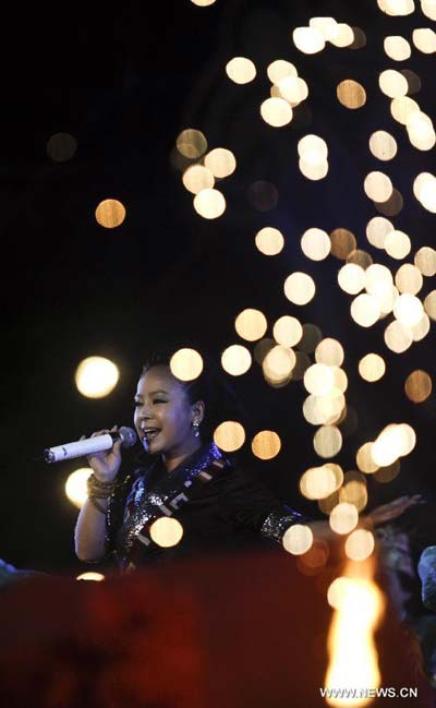 Singer Chongshol Dolma performs during the opening ceremony of 2012 Tibet Yarlung Cultrual Festival in Zetang county of Shannan prefecture, southwest China's Tibet autonomous region, Aug 15, 2012. The festival which kicked off on Wednesday, will last until Aug 21.[