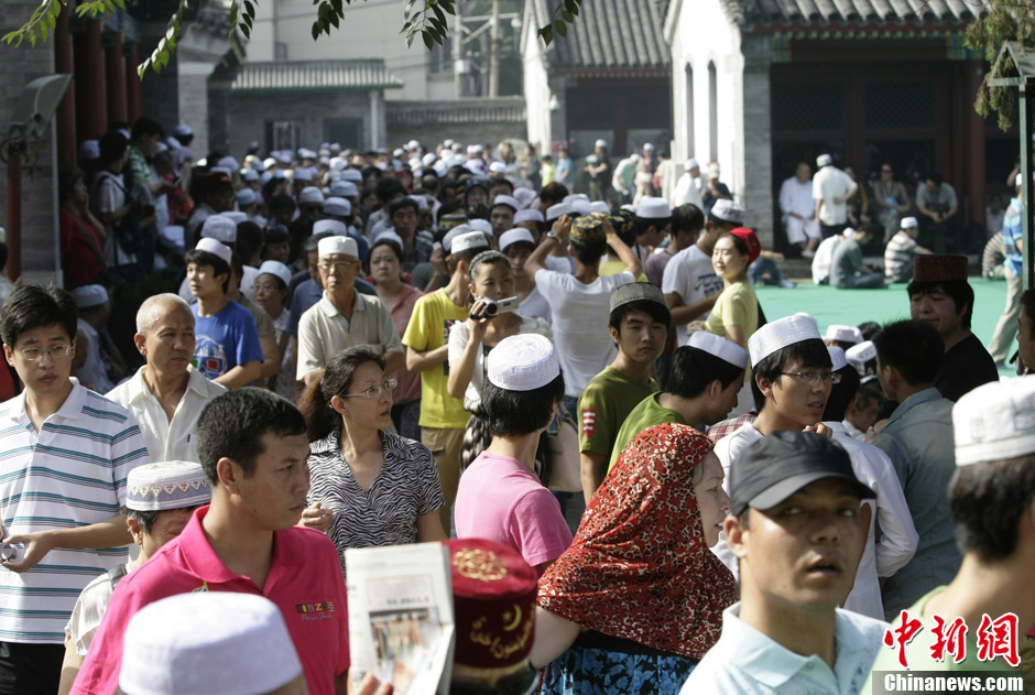 Muslims in China celebrate the end of Ramadan, the month of fasting, on Sunday, Aug. 19, 2012. Thousands of people crowded the Niujie Mosque in Beijing's Muslim quarter for Eid al-Fitr, or the Fast-Breaking Festival.